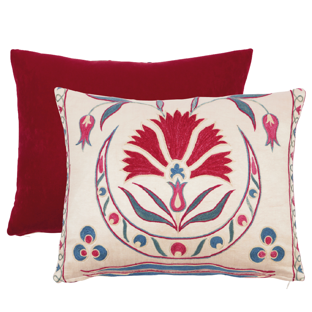 suzani cushion with red and blue patterns