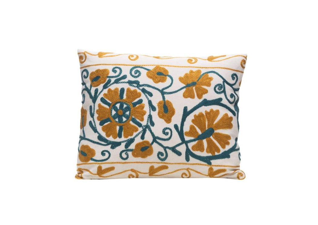 green and yellow embroidered cushion